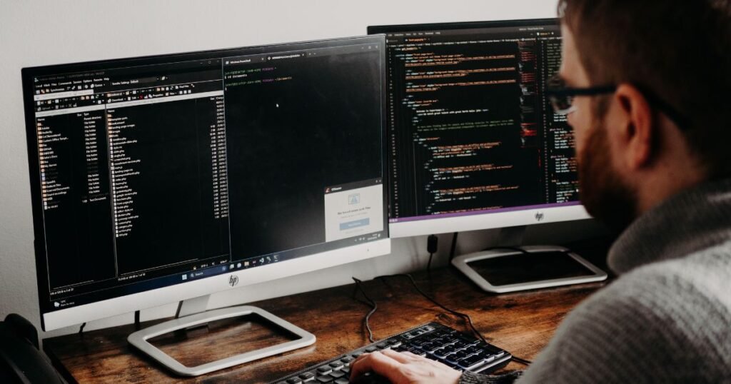 Full stack developer salary in USA 2026 concept showing a developer coding on a laptop