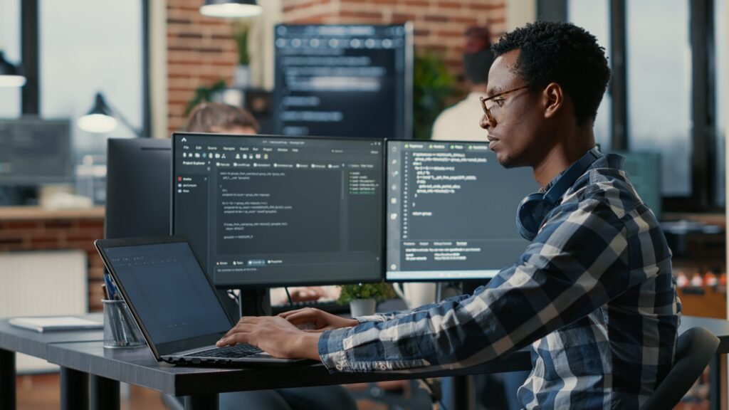 Data scientist working on laptop analyzing data for jobs in USA